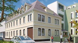 So könnte das Stadtpark-Ensemble künftig aussehen: Die ehemalige Gaststätte (gelb) wird mit Gauben aufgewertet, ein gemeinsames Treppenhaus (grün-weiß) schafft die Verbindung zum zurückversetzten Neubau. Im Vordergrund rechts die Zufahrt zur Tiefgarage.