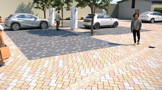 So könnte der Parkplatz beim Dorfgemeinschaftshaus einmal aussehen: Dunkle Steine markieren die Stellflächen, Platz und Straße haben den gleichen Belag, einzig durch eine Rinne optisch getrennt.
