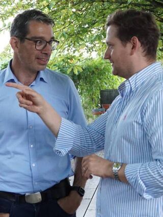 Dr. Andre Baumann und Max Spielmann im Gespräch.